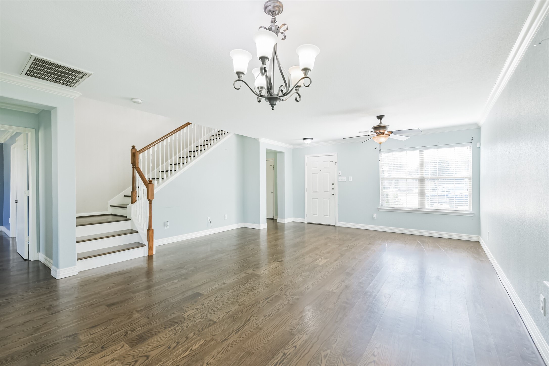 9207 Cribbage Court Houston, TX 77083 - Photo 3 of 47 wooden floor in an empty room with a window