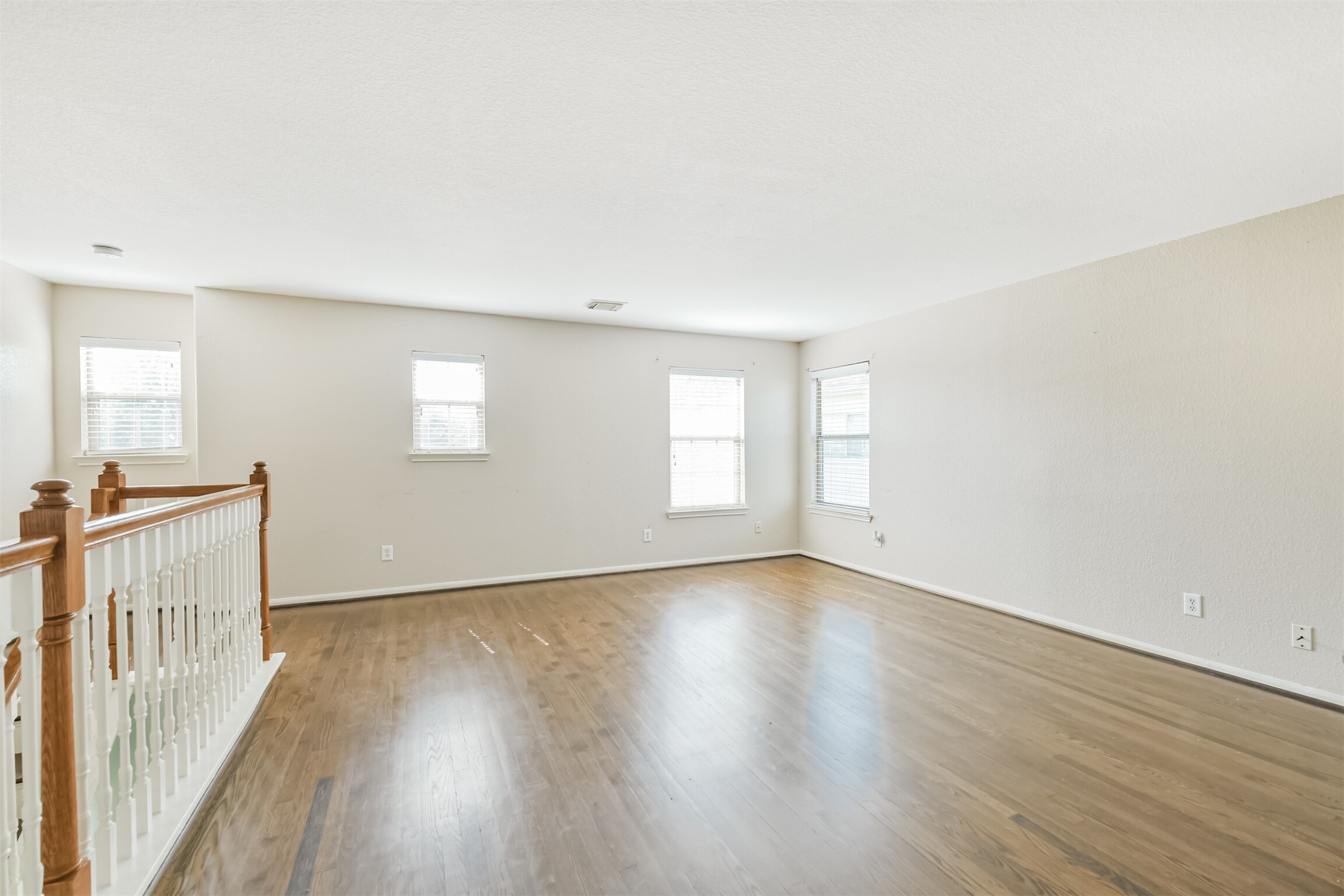 9207 Cribbage Court Houston, TX 77083 - Photo 40 of 47 a view of an empty room with wooden floor and a window