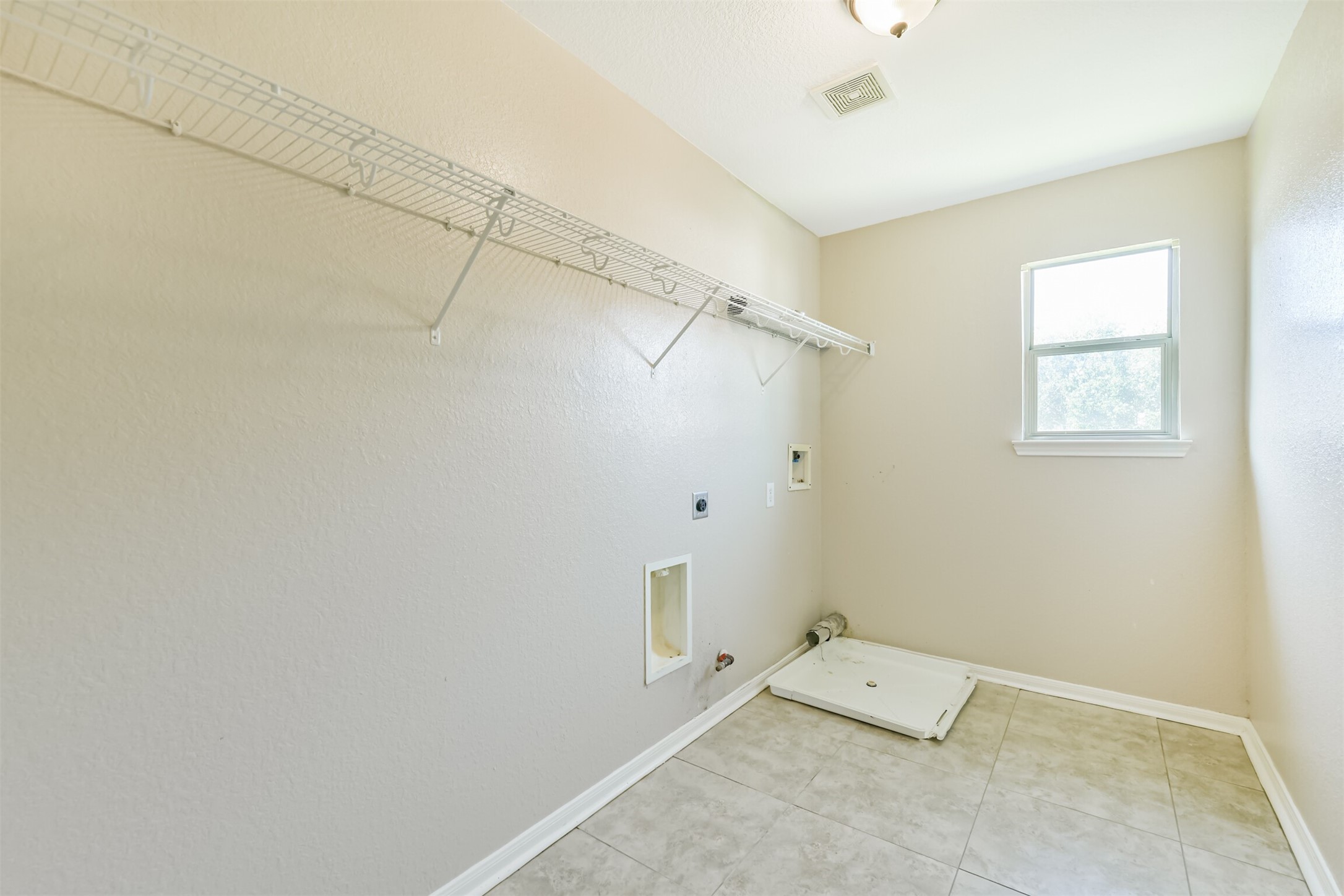 9207 Cribbage Court Houston, TX 77083 - Photo 45 of 47 Upstairs utility room (laundry room)