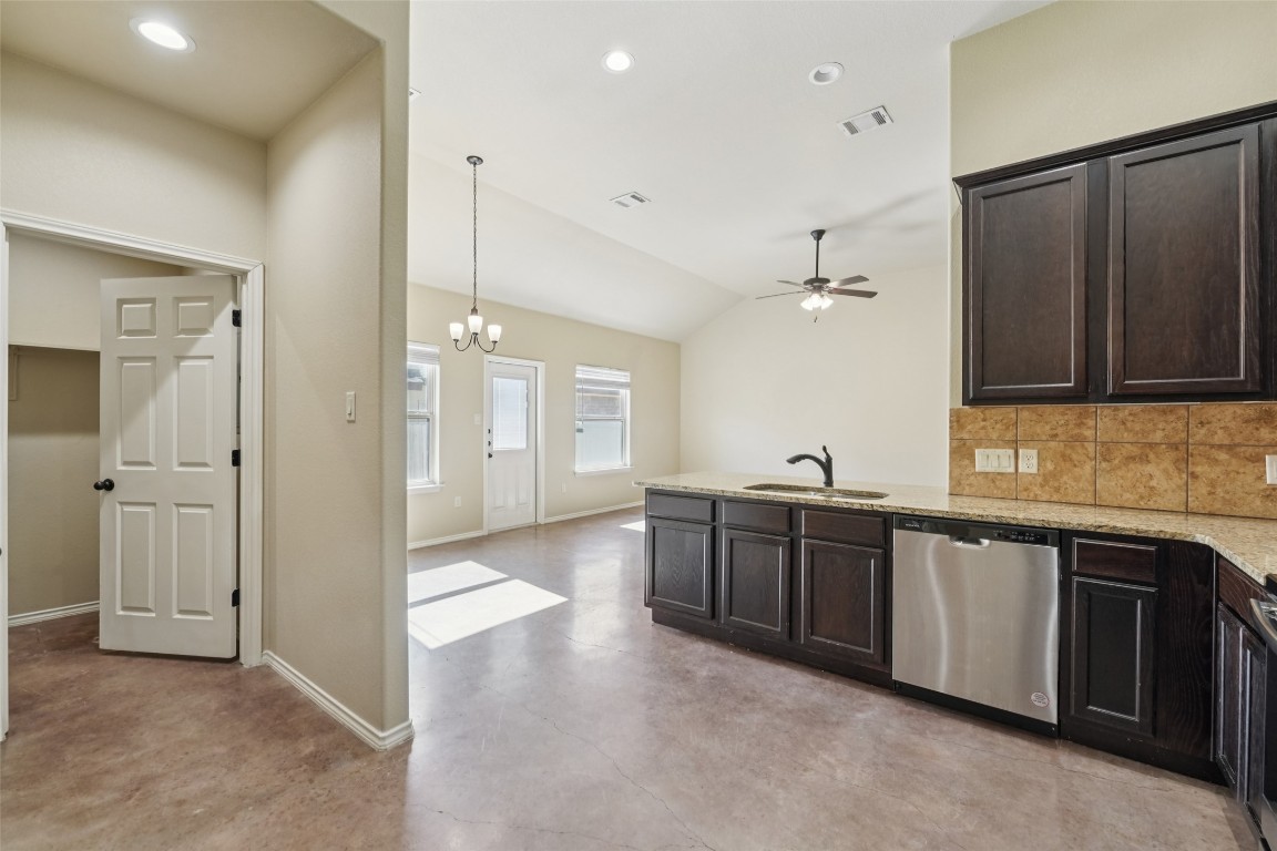 402 Jack Rabbit Lane, Unit B Buda, TX 78610 - Photo 14 of 30 a large kitchen with a lot of counter space and a sink