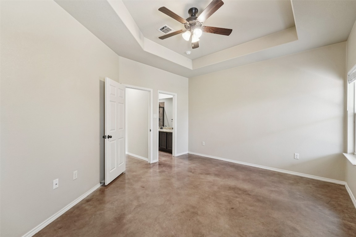 402 Jack Rabbit Lane, Unit B Buda, TX 78610 - Photo 24 of 30 an empty room with closet and a ceiling fan