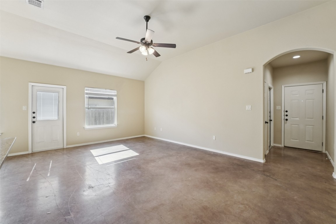 402 Jack Rabbit Lane, Unit B Buda, TX 78610 - Photo 6 of 30 wooden floor in an empty room with a window
