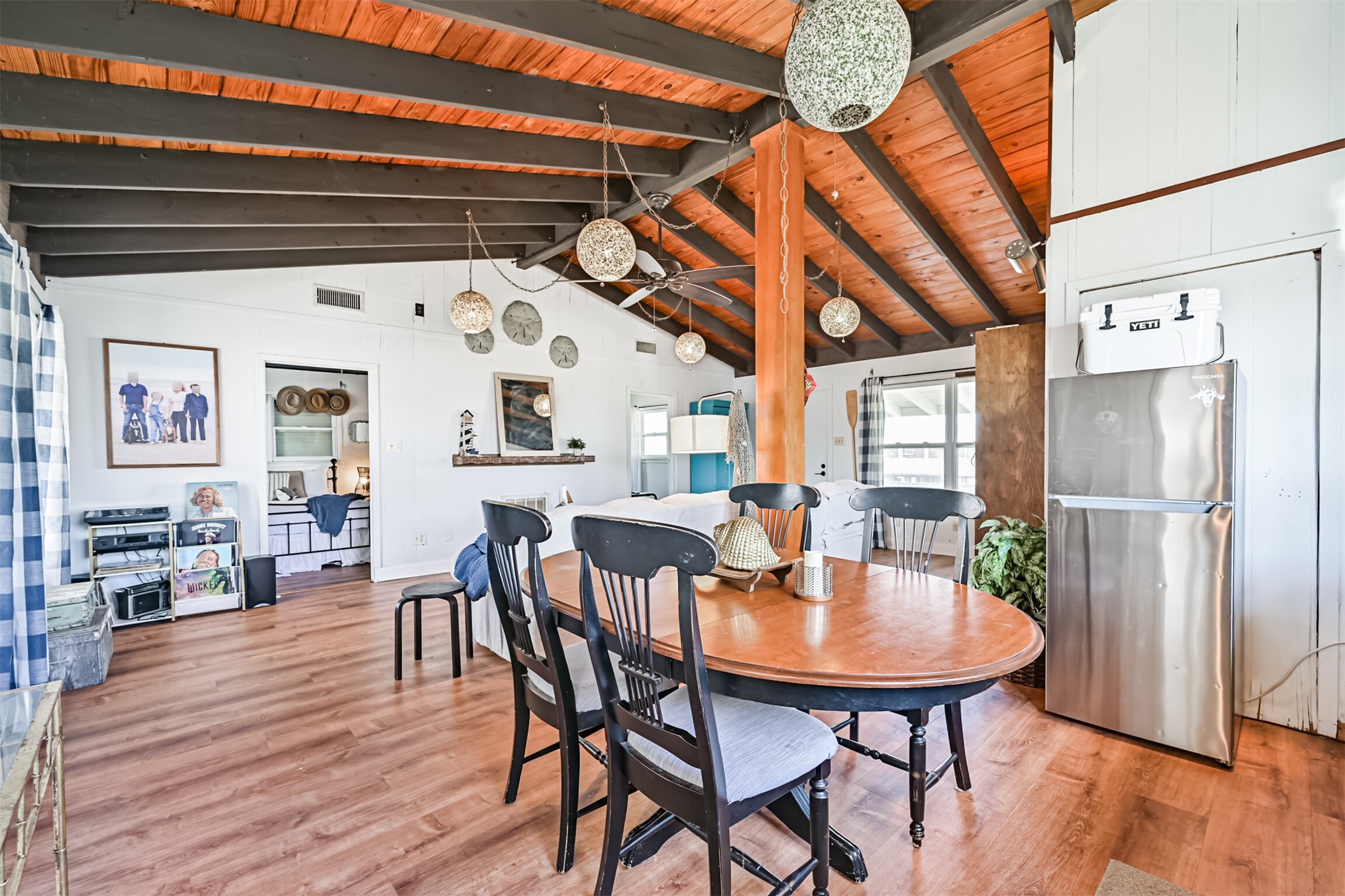 16519 Captain Kidd Road Jamaica Beach, TX 77554 - Photo 12 of 32 a view of a dining room with furniture window and wooden floor