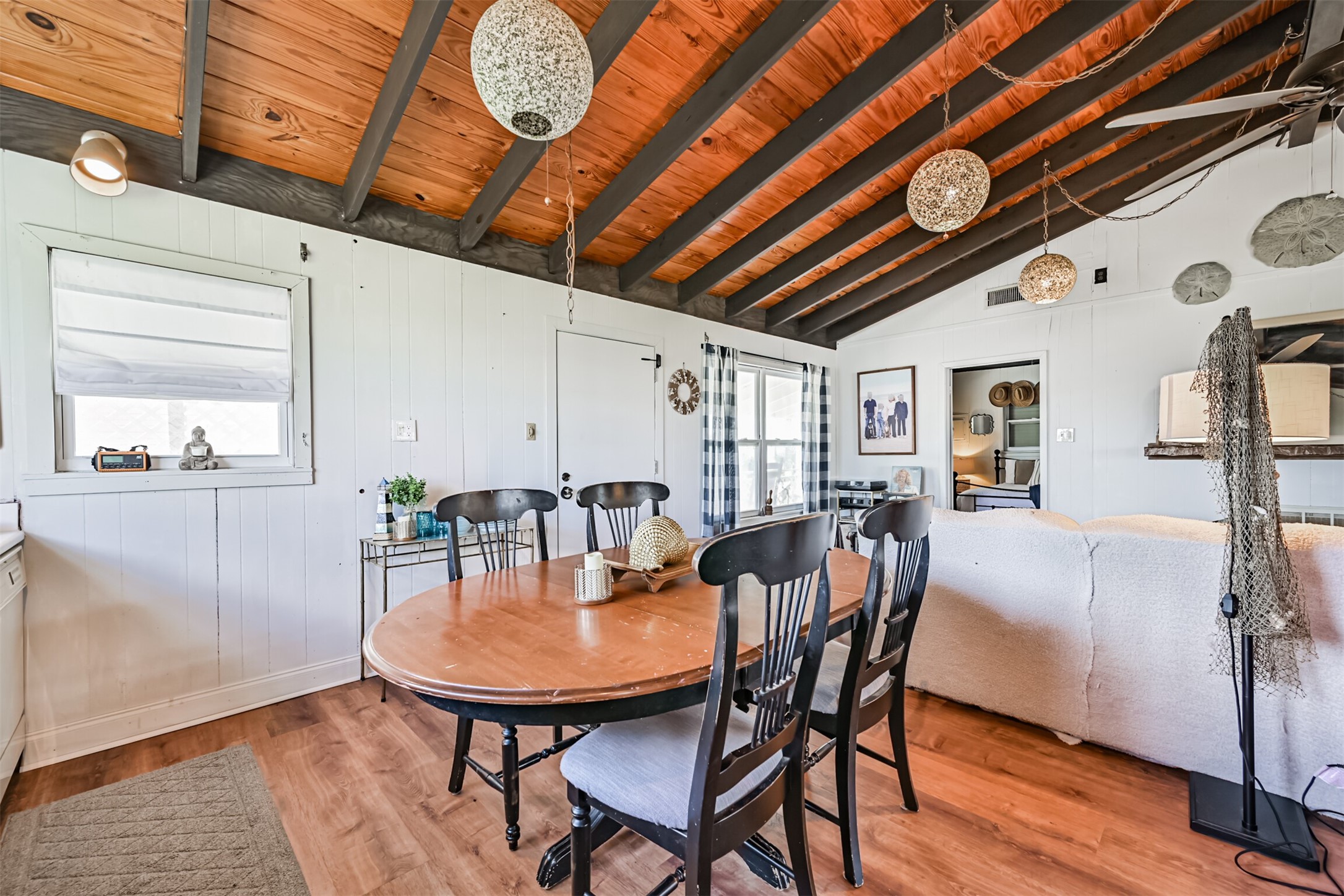 16519 Captain Kidd Road Jamaica Beach, TX 77554 - Photo 13 of 32 a dining room with furniture and window
