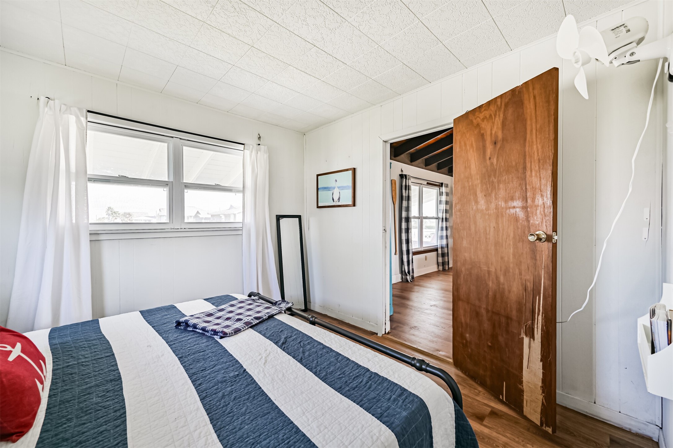 16519 Captain Kidd Road Jamaica Beach, TX 77554 - Photo 15 of 32 a bedroom with a bed and a window
