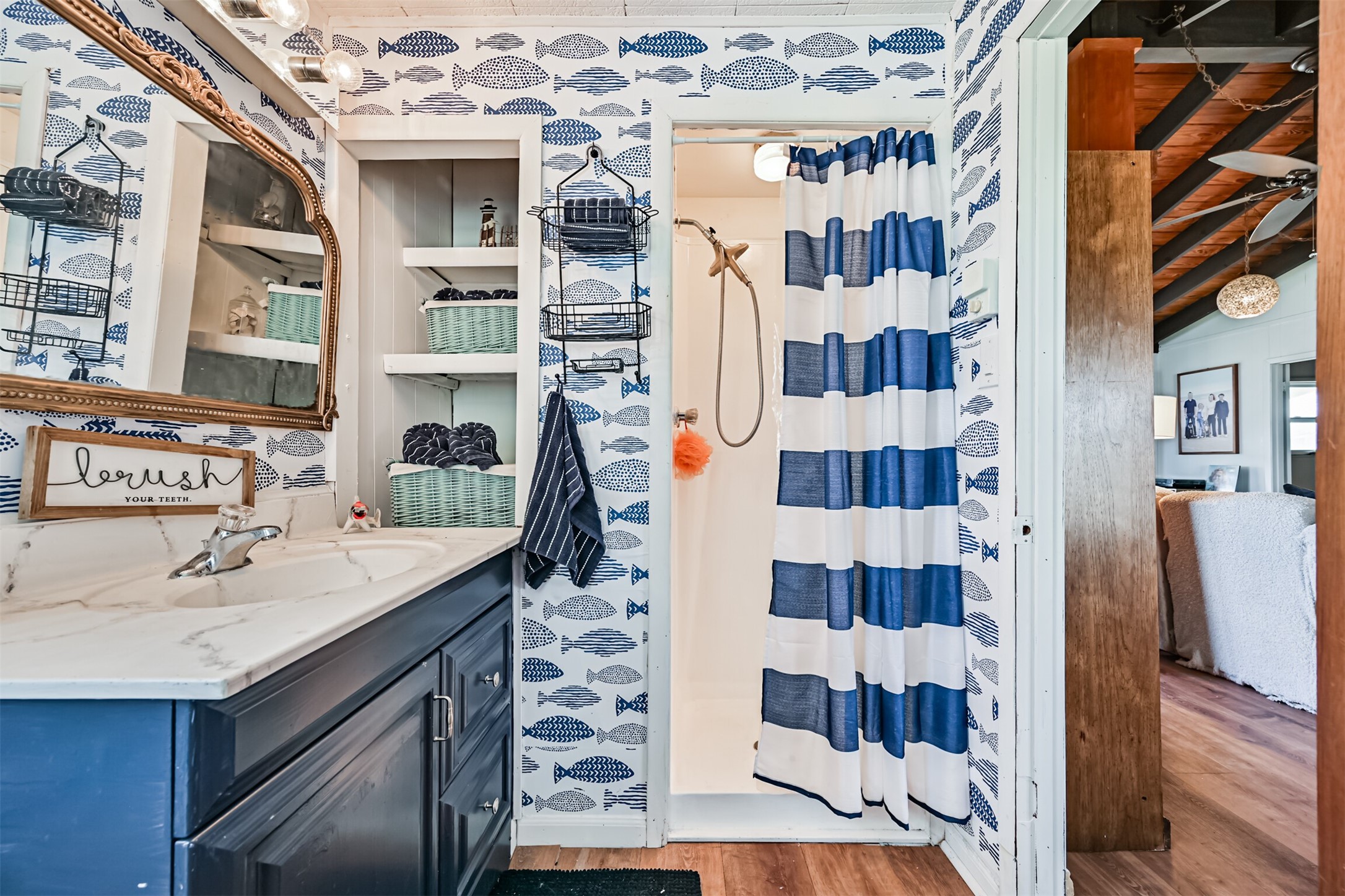 16519 Captain Kidd Road Jamaica Beach, TX 77554 - Photo 17 of 32 a bathroom with a sink and a shower