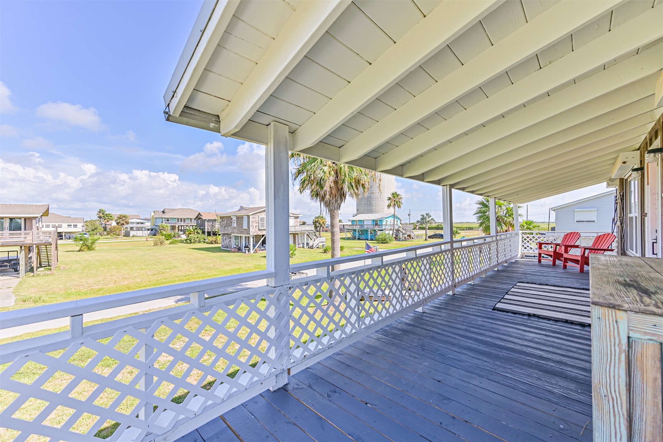 16519 Captain Kidd Road Jamaica Beach, TX 77554 - Photo 25 of 32 a view of a balcony with wooden floor
