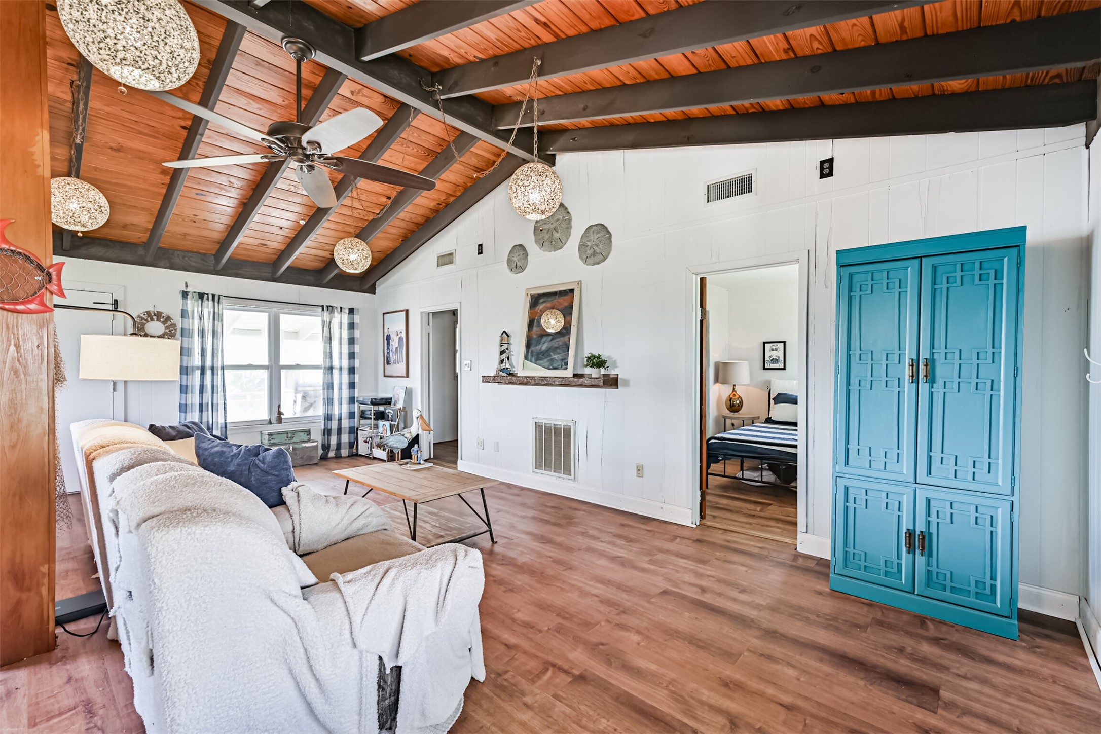 16519 Captain Kidd Road Jamaica Beach, TX 77554 - Photo 4 of 32 a living room with furniture and wooden floors