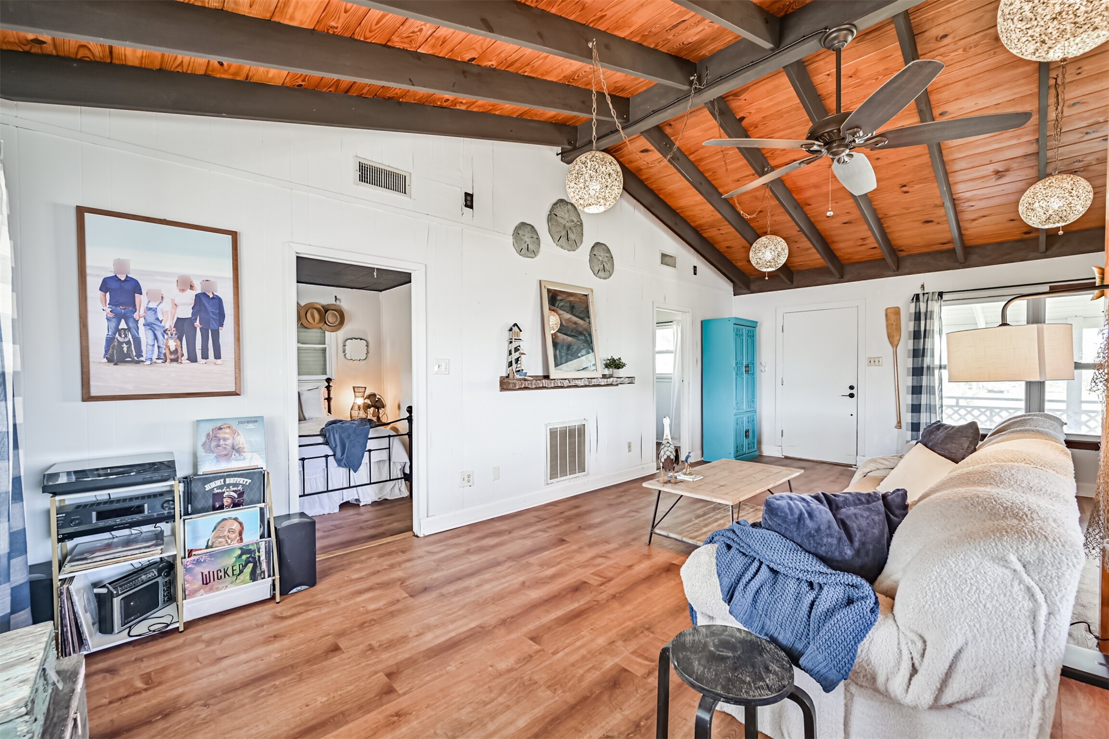 16519 Captain Kidd Road Jamaica Beach, TX 77554 - Photo 6 of 32 a living room with furniture and wooden floor