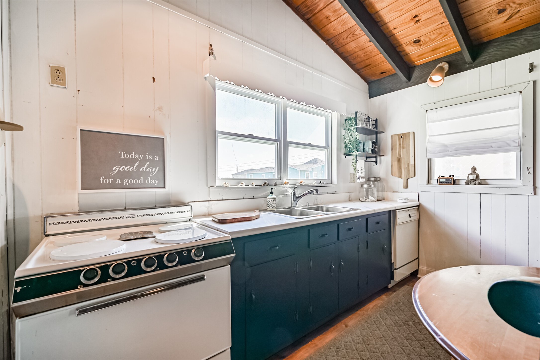 16519 Captain Kidd Road Jamaica Beach, TX 77554 - Photo 10 of 32 a kitchen with a sink stove and cabinets