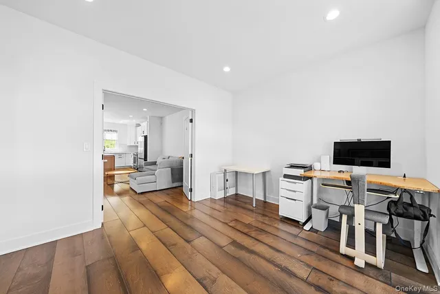 a hotel room with a bed and a television