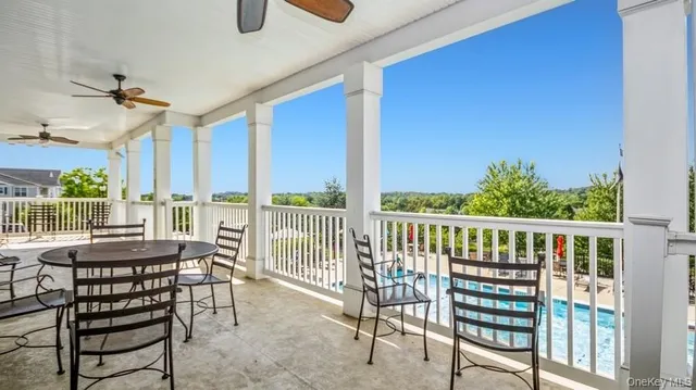 a view of a balcony with furniture