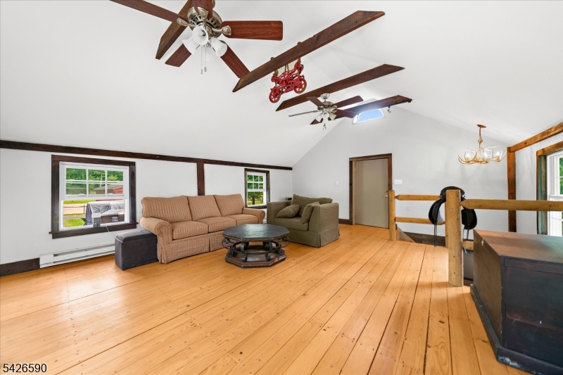 179 Lindbergh Road Hopewell, NJ 08525 - Photo 35 of 46 a living room with furniture and a flat screen tv