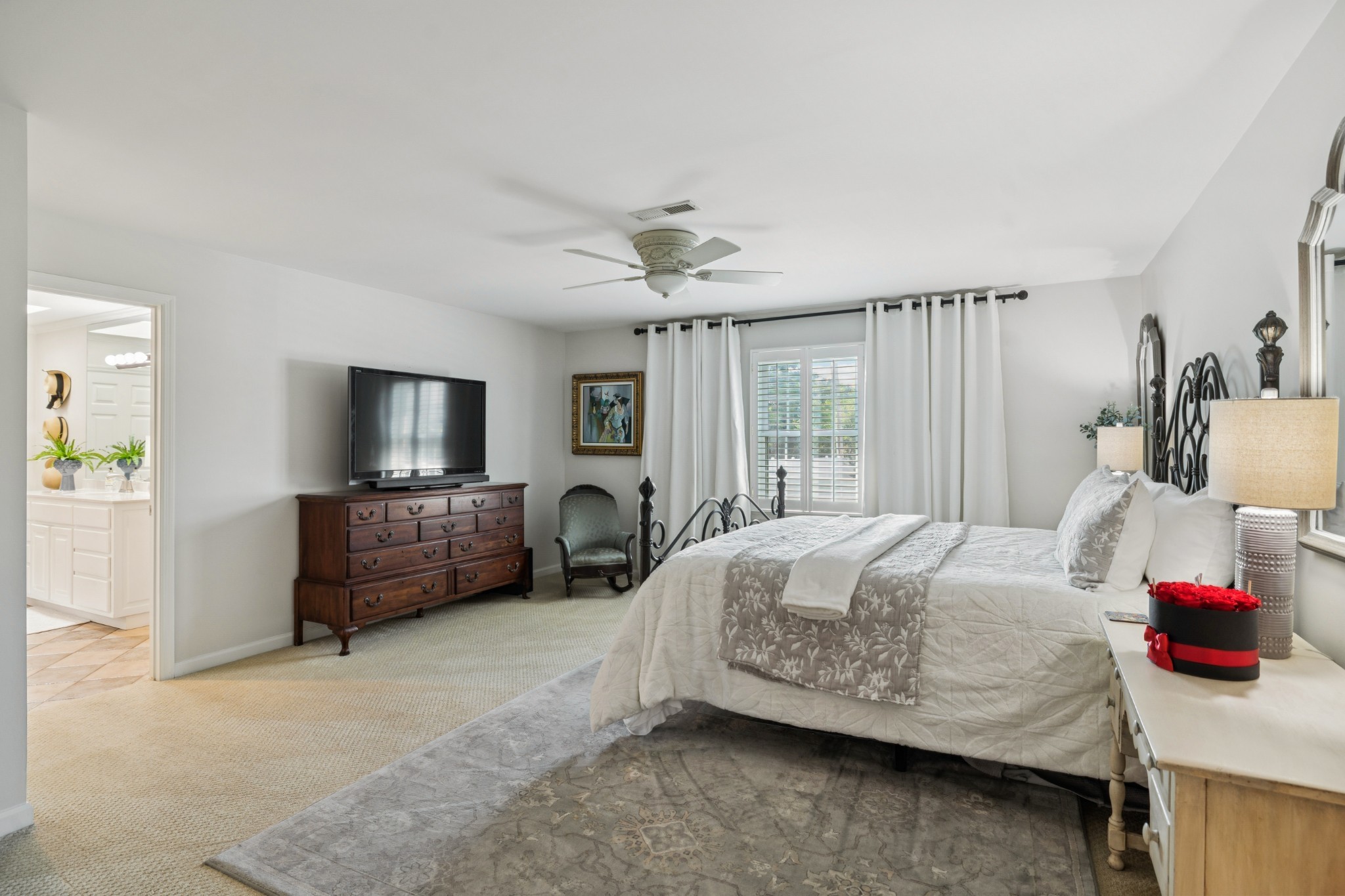 121 Pebble View Drive Franklin, TN 37064 - Photo 28 of 49 a bedroom with a bed a couch and a flat tv screen on dresser