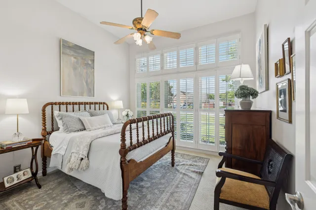 a bedroom with furniture and a window