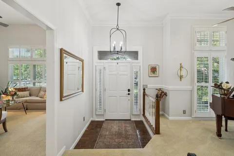 a view of a livingroom with furniture window and wooden floor