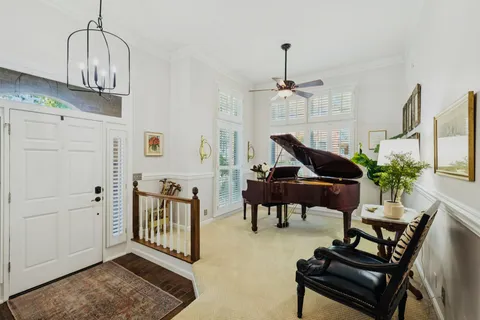 a livingroom with dining area a livingroom and chandelier