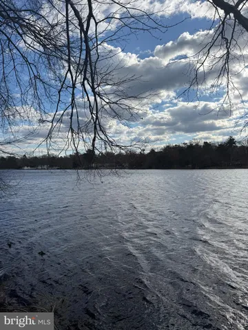 a view of yard with wooden fence