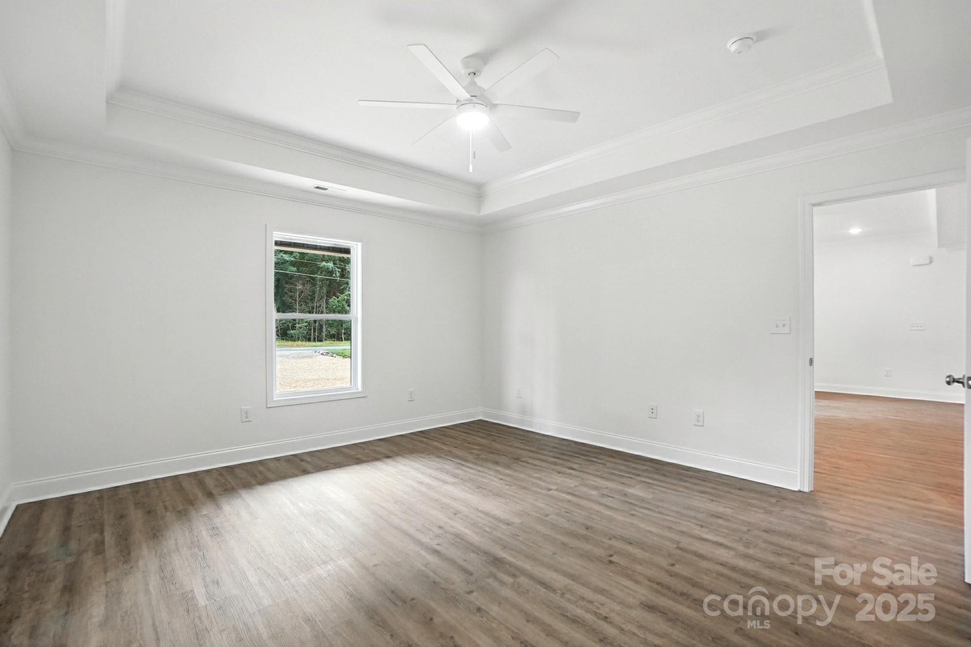 251 Lincoln Road York, SC 29745 - Photo 17 of 30 an empty room with wooden floor and windows