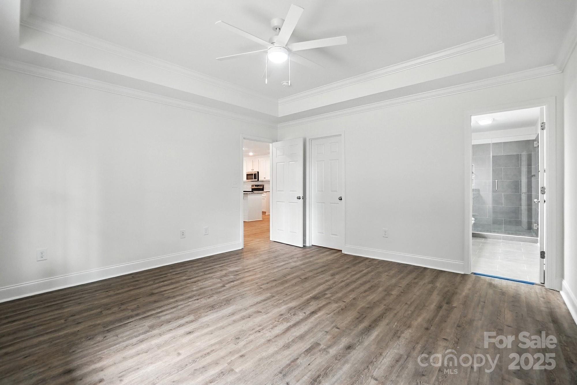 251 Lincoln Road York, SC 29745 - Photo 18 of 30 an empty room with wooden floor and a ceiling fan
