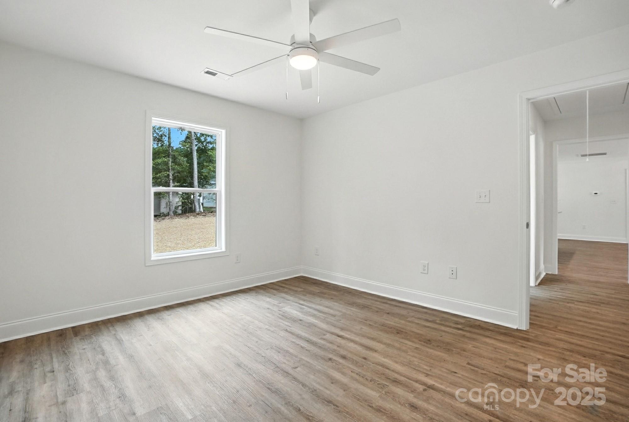 251 Lincoln Road York, SC 29745 - Photo 24 of 30 wooden floor in an empty room with a window