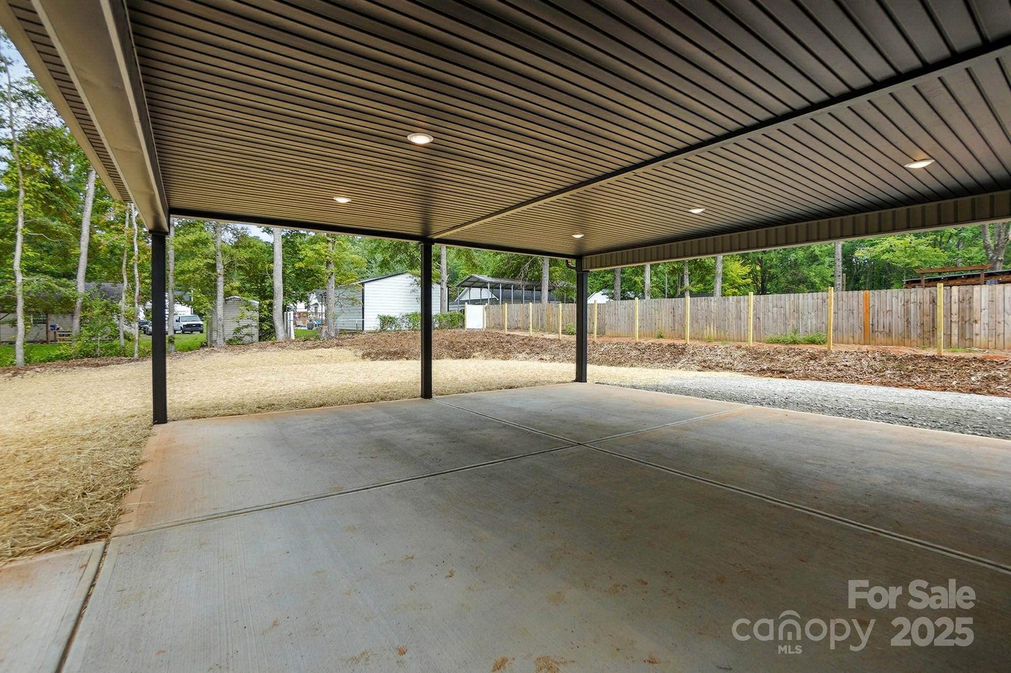 251 Lincoln Road York, SC 29745 - Photo 29 of 30 a view of a patio with a table and chairs under an umbrella