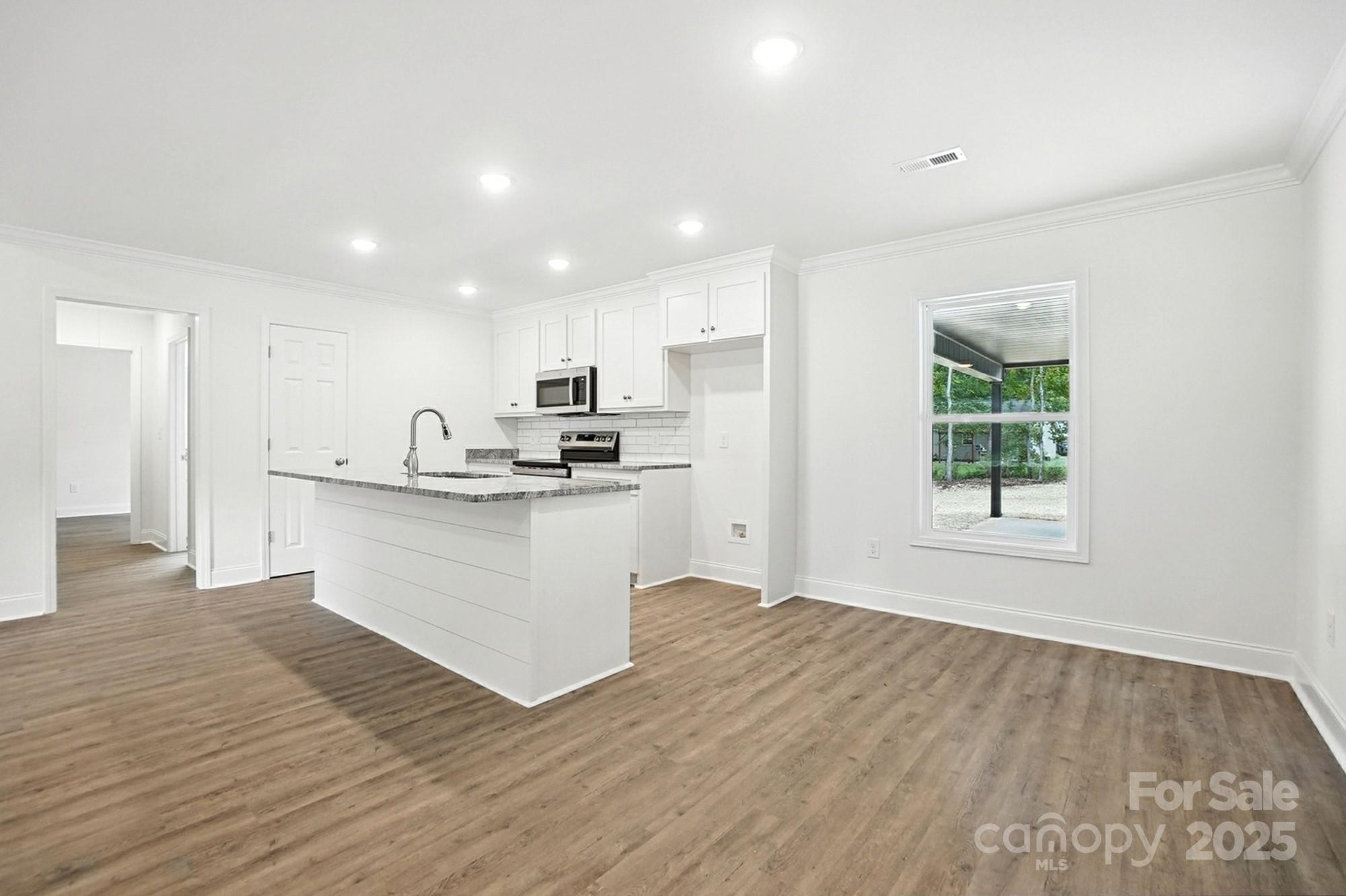 251 Lincoln Road York, SC 29745 - Photo 9 of 30 a view of kitchen with wooden floor and electronic appliances