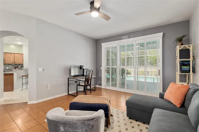 a view of a dining room with furniture and chandelier
