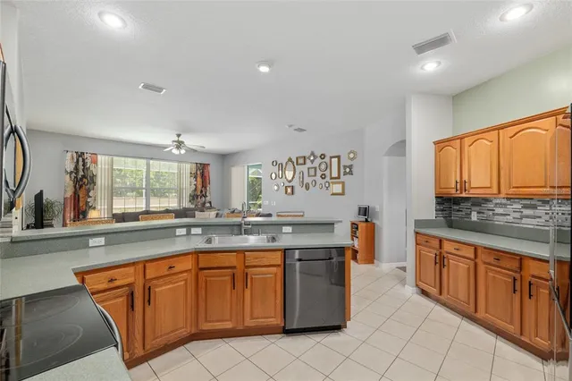 a bed sitting in a spacious bedroom next to a window