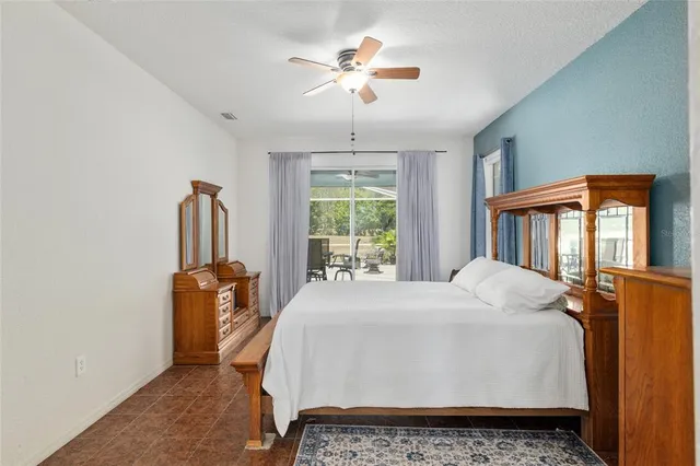 a bathroom with a granite countertop bathtub shower and sink