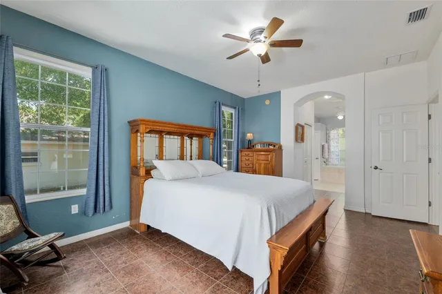a white bath tub sitting next to a window
