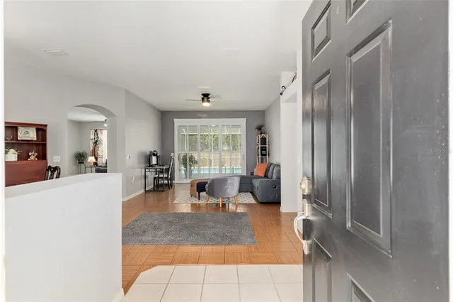 a living room with furniture and a large window