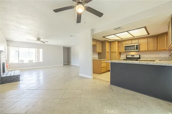 a view of a kitchen with a sink and cabinets