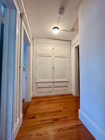 a view of a room with wooden door