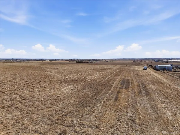 a view of an ocean beach and a city view