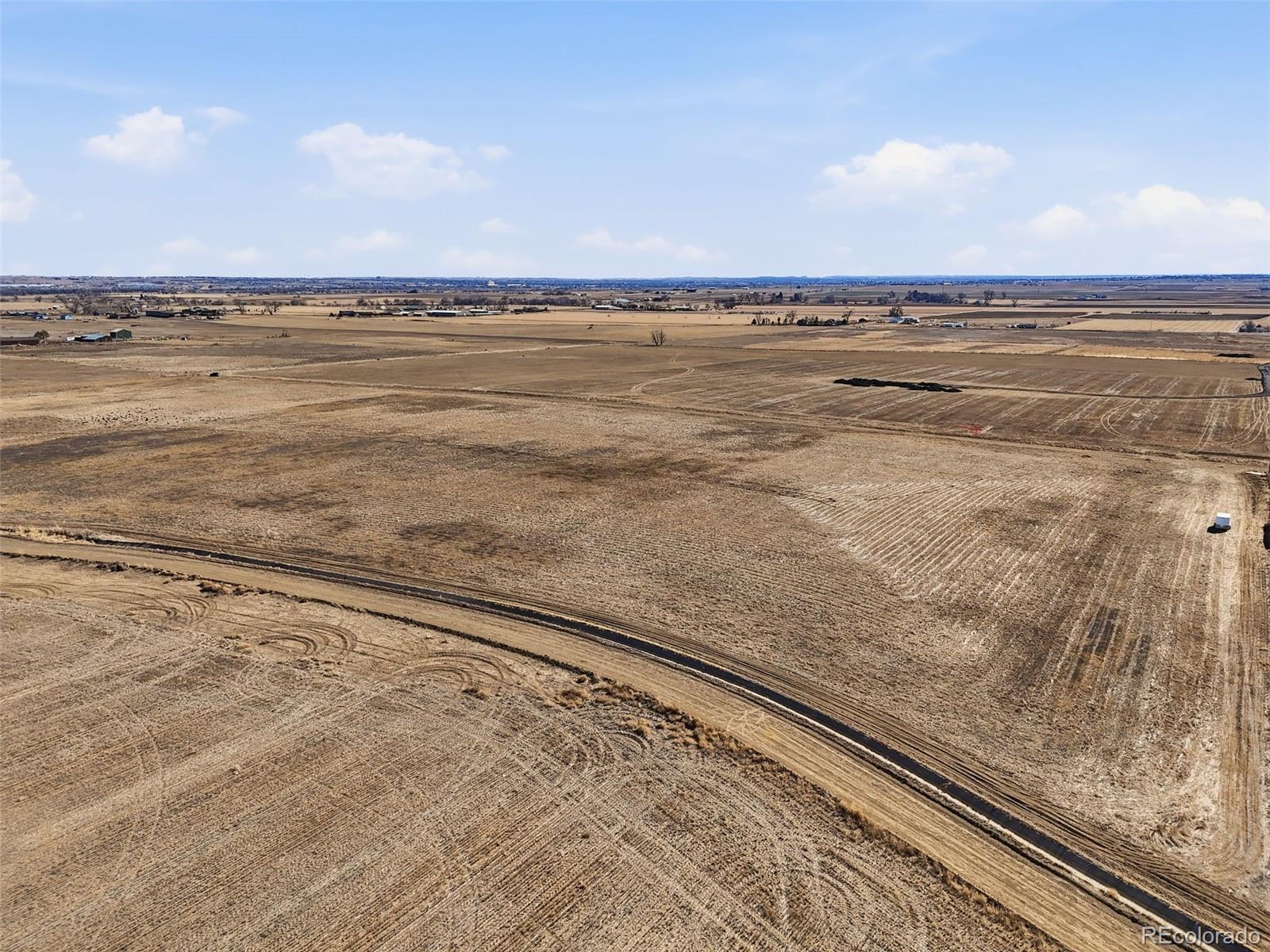 19 Wc Road Fort Lupton, CO 80621 - Photo 5 of 25 a view of an ocean beach and a building