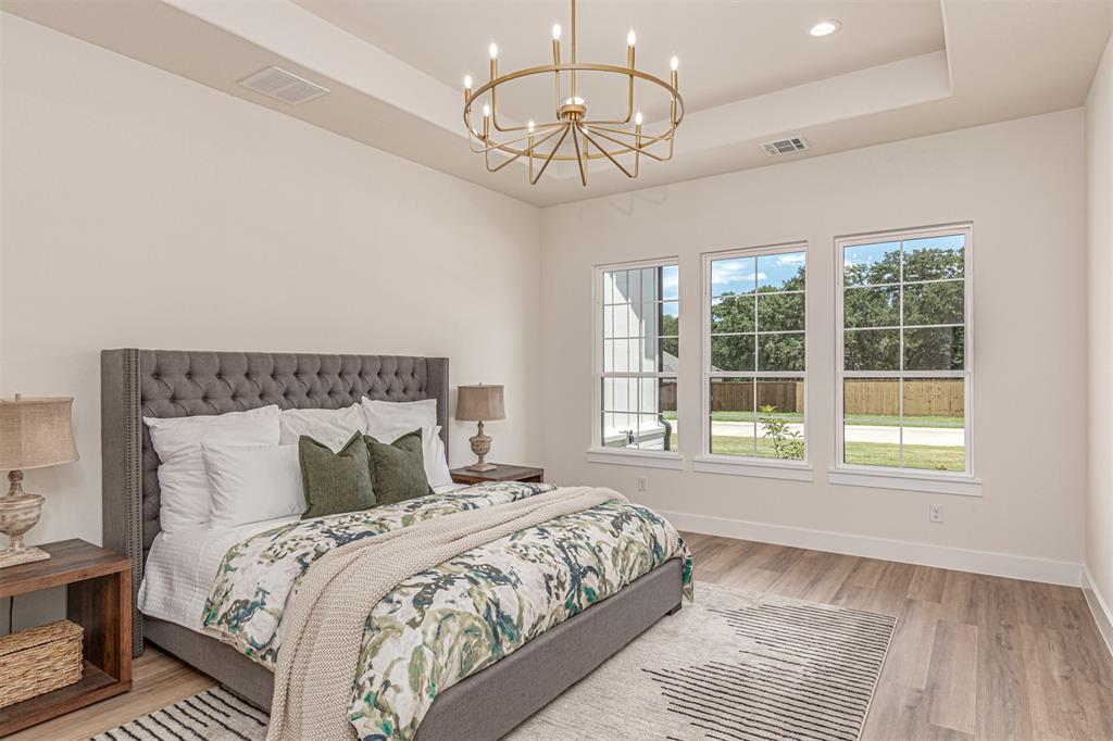 360 Dalton Road Canton, TX 75103 - Photo 14 of 33 Spacious bedroom featuring light-toned walls, tray ceiling, and recessed lighting