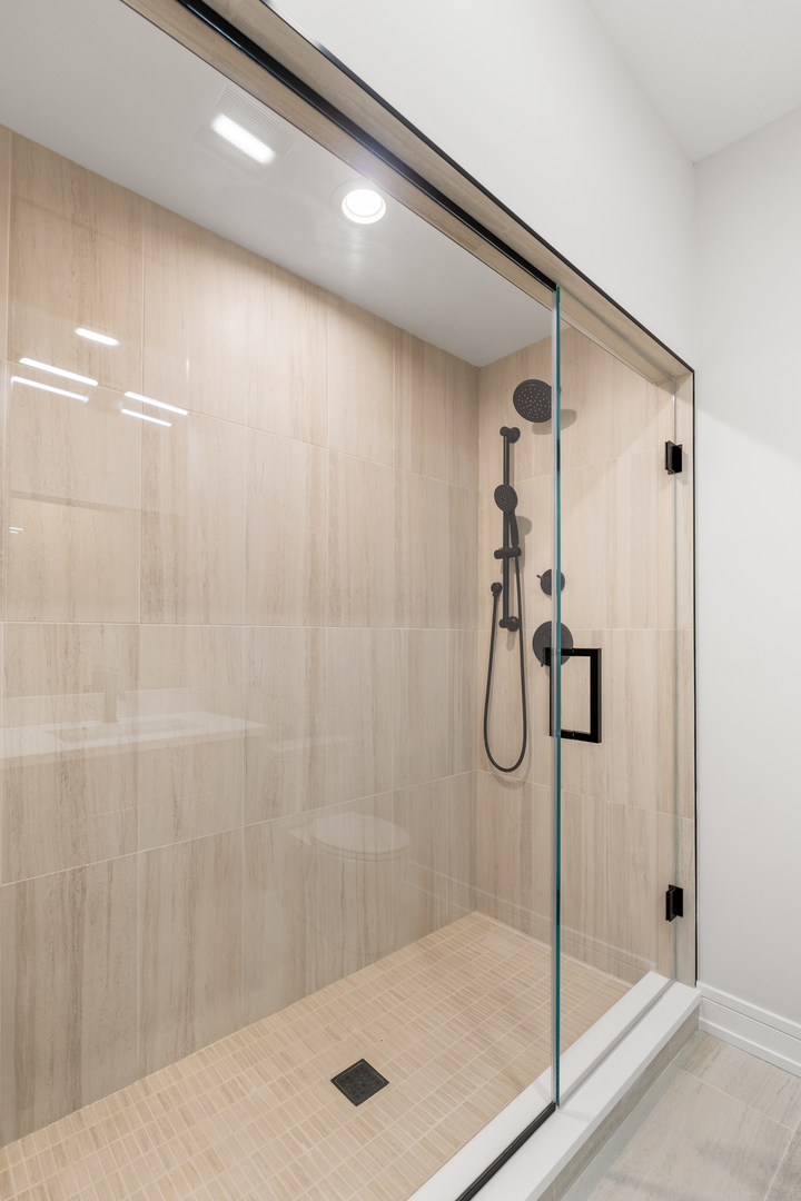 5008 South Prairie Avenue Chicago, IL 60615 - Photo 18 of 26 a bathroom with a glass shower door