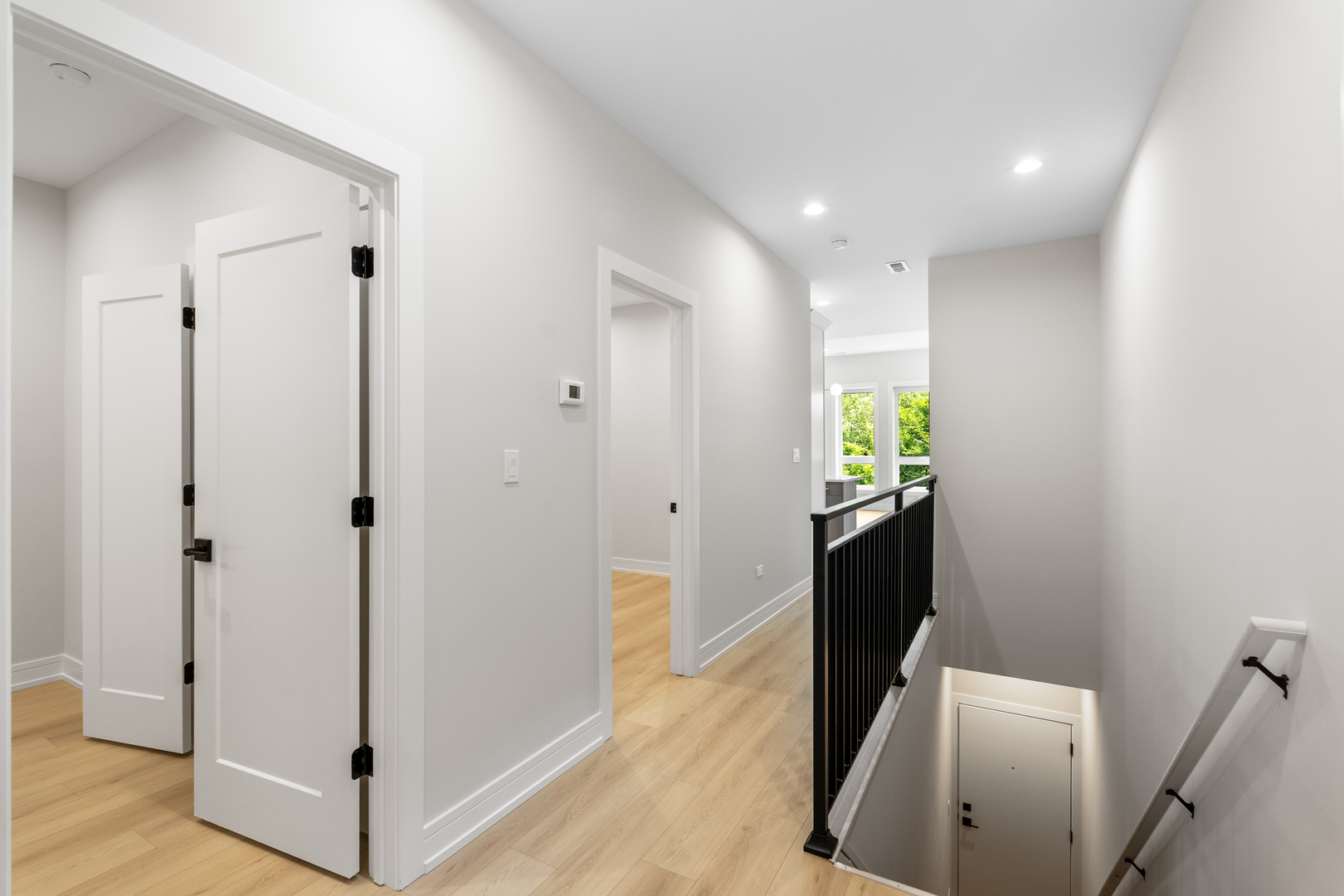 5008 South Prairie Avenue Chicago, IL 60615 - Photo 9 of 26 a view of a hallway with wooden floor and stairs