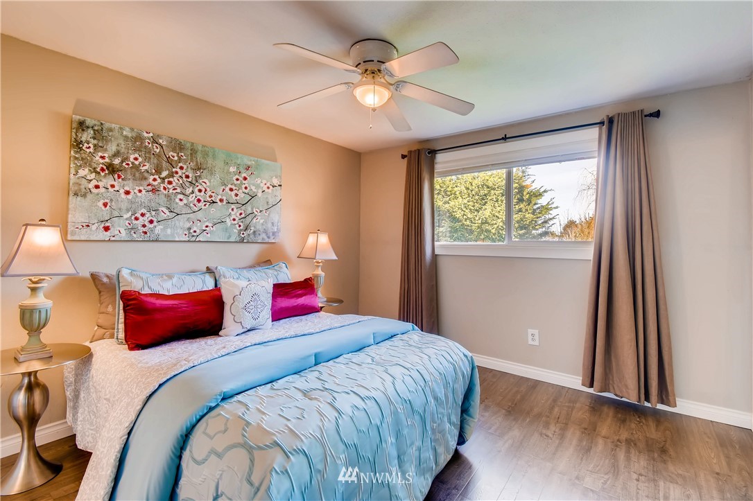 908 North 33rd Street Renton, WA 98056 - Photo 12 of 22 a bedroom with a bed and a window