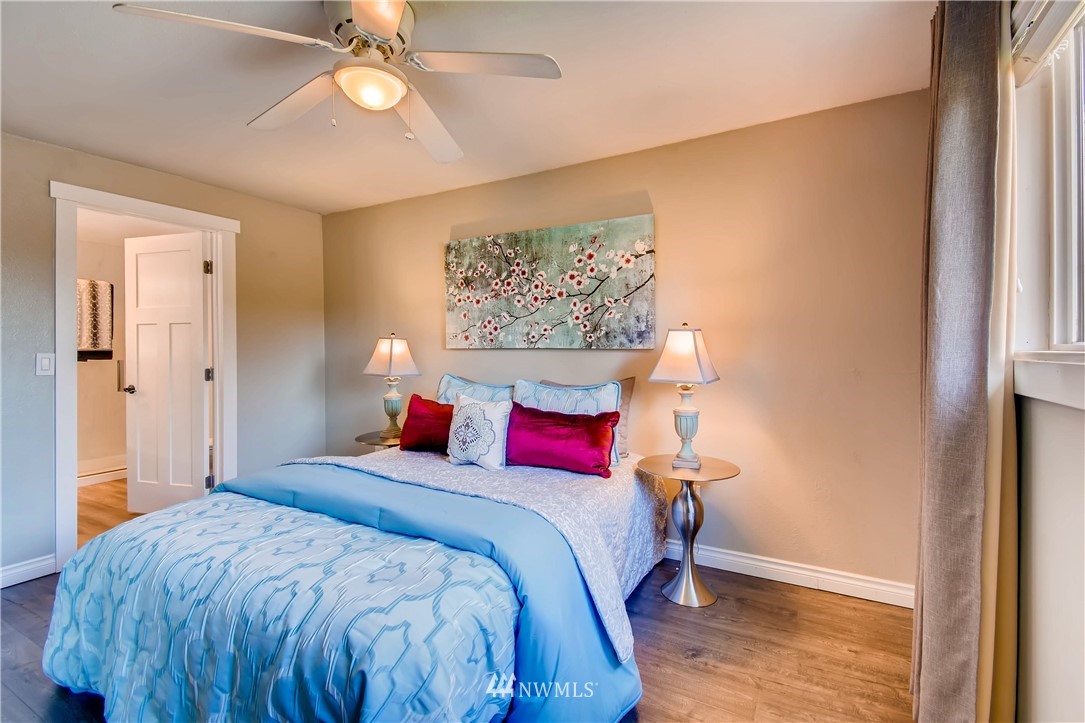 908 North 33rd Street Renton, WA 98056 - Photo 13 of 22 a bedroom with a bed and a chandelier