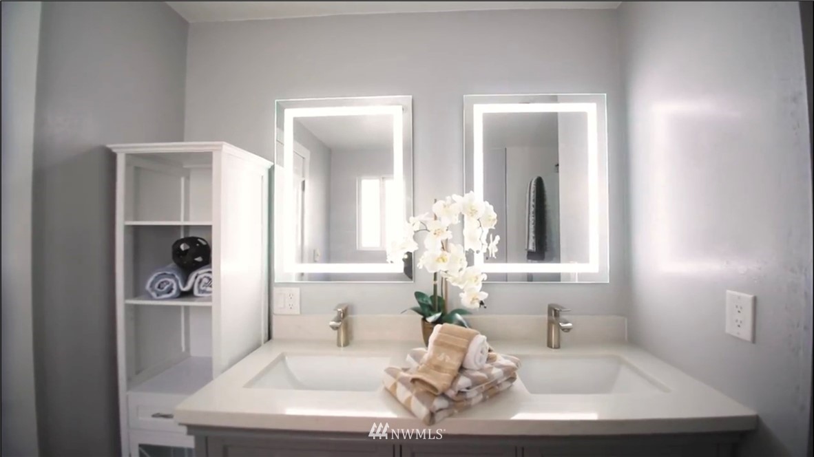 908 North 33rd Street Renton, WA 98056 - Photo 15 of 22 a bathroom with a sink and a mirror