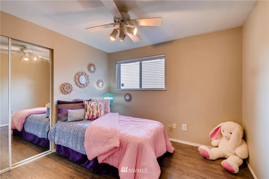 908 North 33rd Street Renton, WA 98056 - Photo 18 of 22 a bedroom with a bed and a window