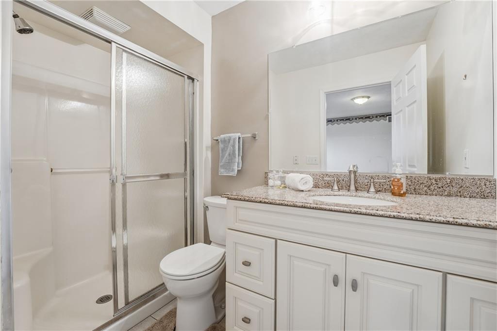 3699 Mitchell Road New Castle, PA 16105 - Photo 11 of 14 a bathroom with a granite countertop toilet sink and shower