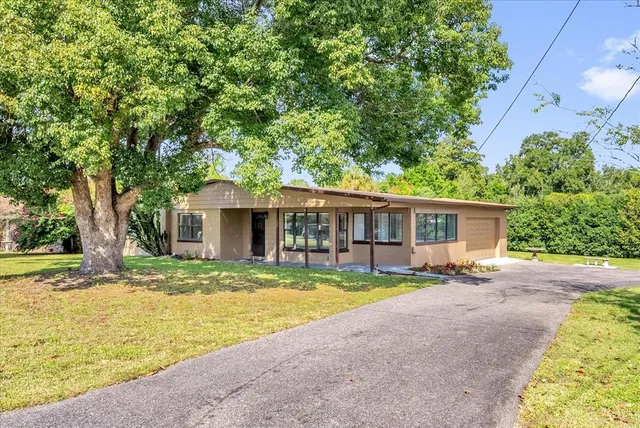 a house with trees in the background
