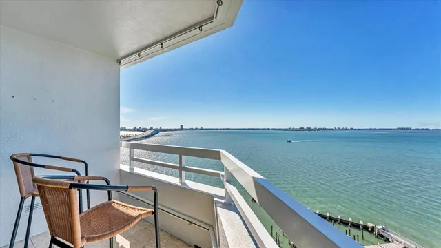 a view of a chair and table in the balcony