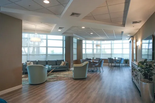 a view of a swimming pool with a table and chairs