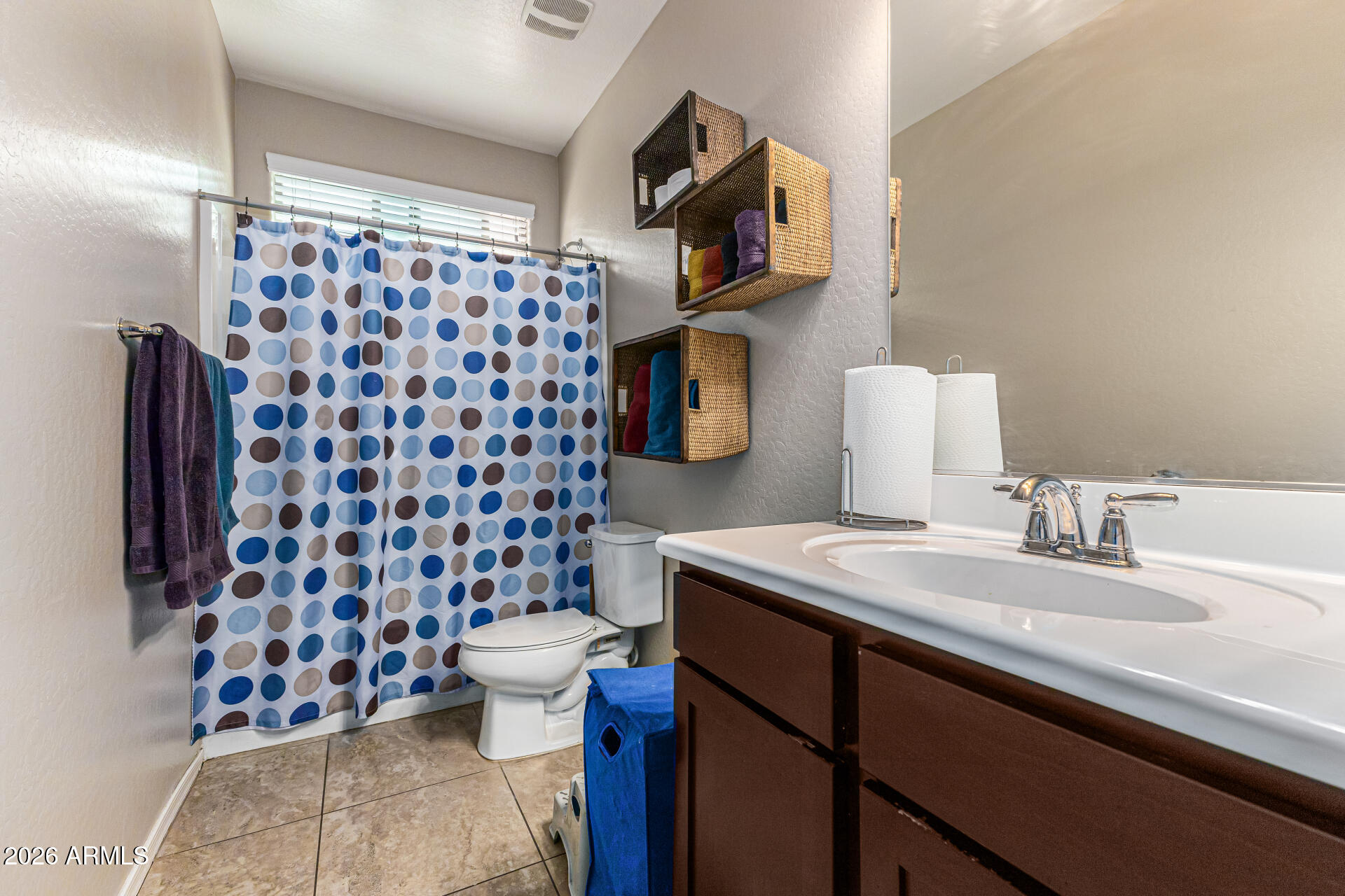 12214 West Del Rio Lane Avondale, AZ 85323 - Photo 23 of 32 a bathroom with a sink toilet and shower
