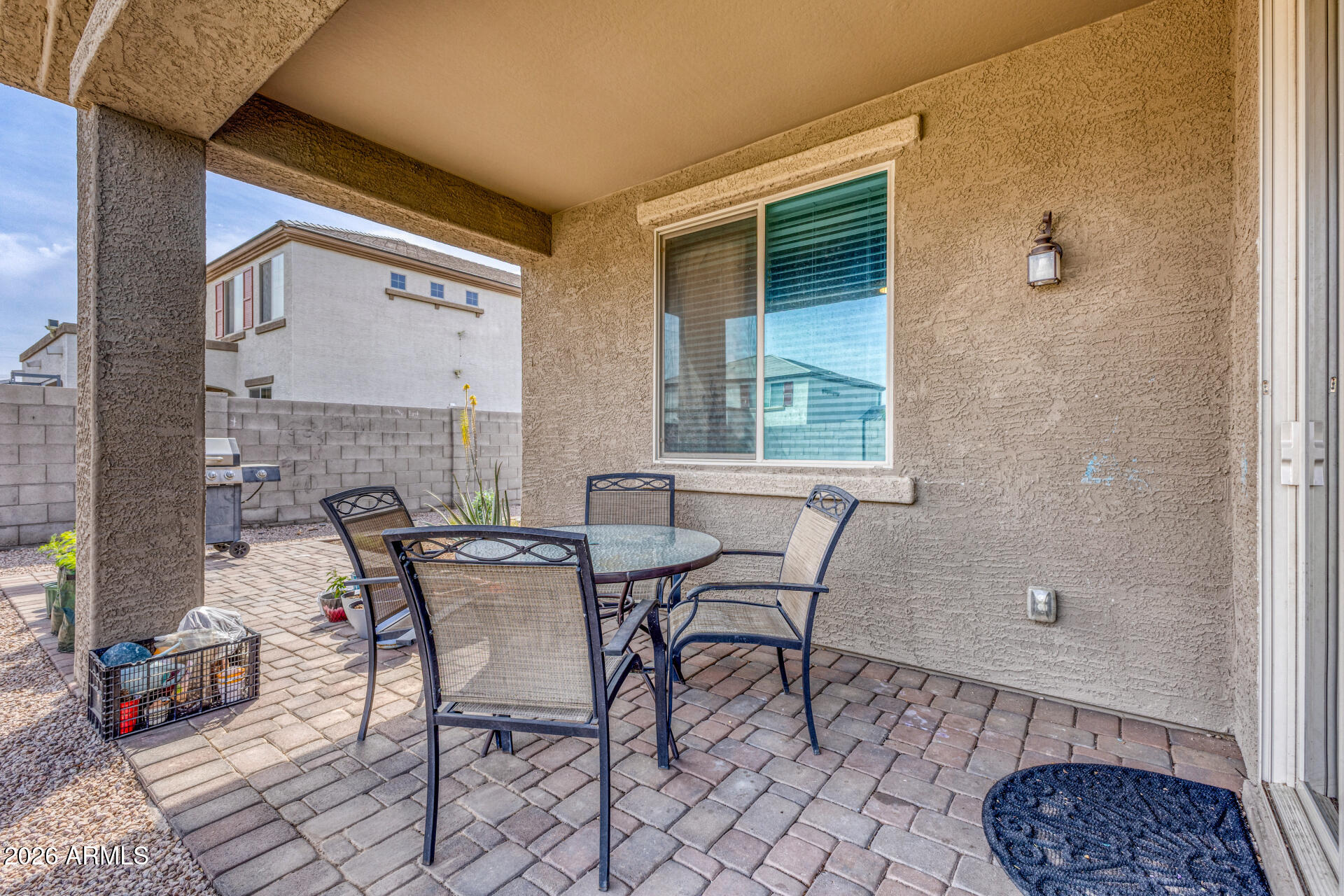12214 West Del Rio Lane Avondale, AZ 85323 - Photo 25 of 32 a balcony with table and chairs