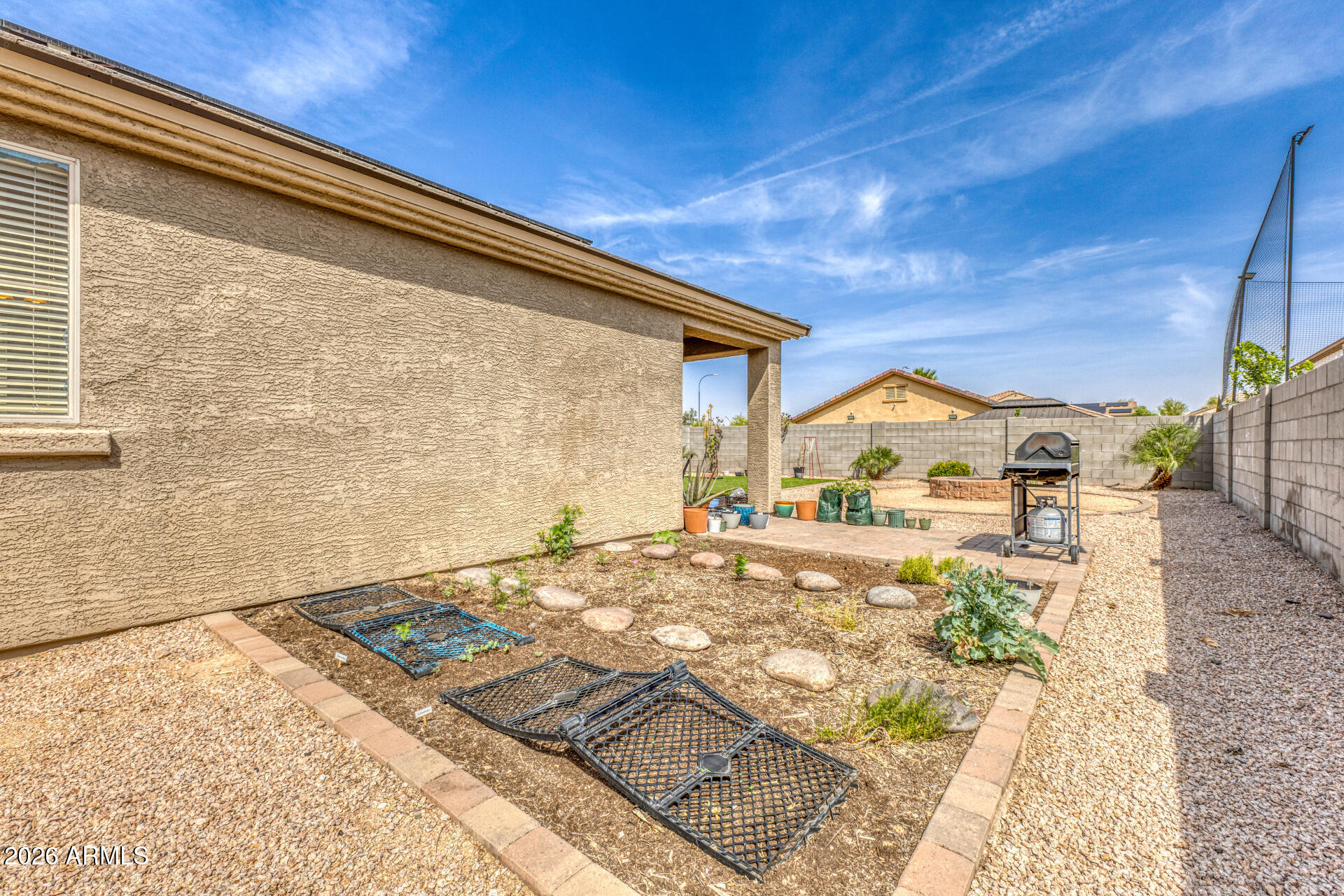 12214 West Del Rio Lane Avondale, AZ 85323 - Photo 28 of 32 a view of a backyard with a patio